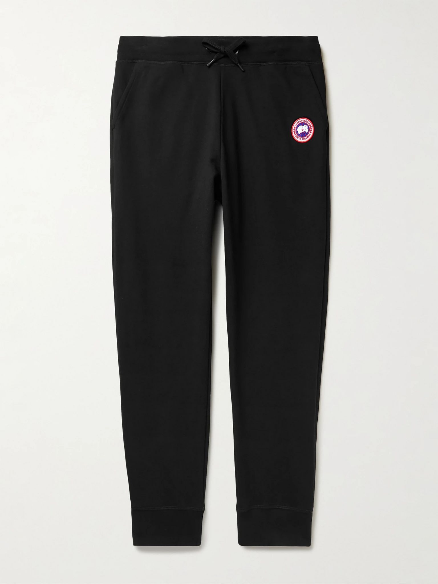 Canada Goose Huron Tapered Logo-Appliquéd Cotton-Jersey Sweatpants Black Canada Goose Huron Tapered Logo-Appliquéd Cotton-Jersey Sweatpants Black - Image 1